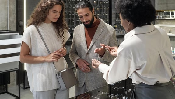 Luxury retail sales consultant serving customers in a store