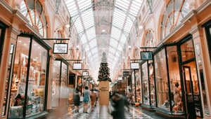 An indoor shopping arcade decorated for the holidays