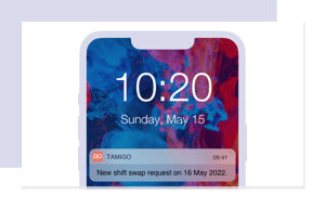 Screenshot of a phone with locked screen displaying a push notification from tamigo’s employee engagement app, indicating a new shift swap request for 16 May 2022.