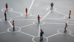 People standing on circles connected by lines